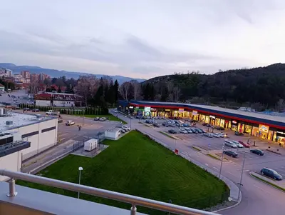 an aerial view of a parking lot with a building at Apartman Elizabet in Pirot