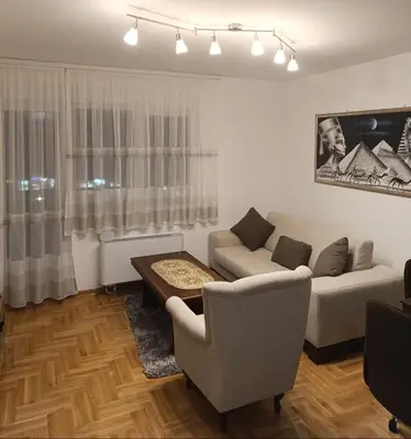 a living room with a couch and a table at Apartman Elizabet in Pirot