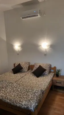 a bed in a room with two pillows on it at Studio Janko in Vrnjačka Banja