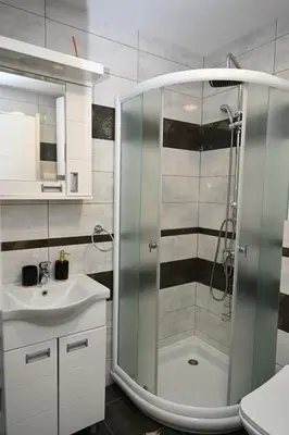 a bathroom with a shower and a sink at Apartman A&A lux in Vrnjačka Banja