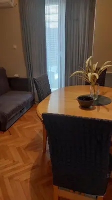 a dining room table with a bowl on top of it at Apartman La Viva Sokobanja in Soko Banja