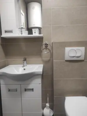a bathroom with a sink and a toilet at Cera premium apartment in Soko Banja