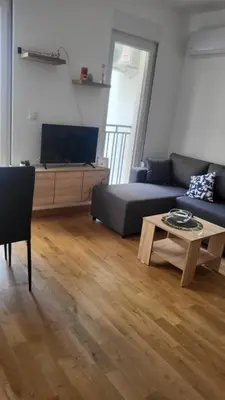 a living room with a couch and a coffee table at Milica i Vuk in Vrnjačka Banja