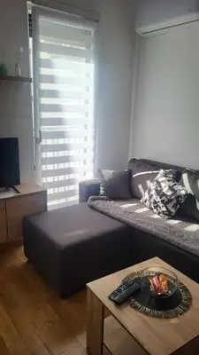 a living room with a couch and a coffee table at Milica i Vuk in Vrnjačka Banja