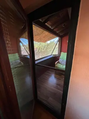 a view of a room with a window and a couch at Apartmani Milanović Jagodina in Jagodina
