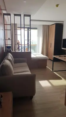 a living room with a couch and a bed at Residence hill Studio Rocco in Kopaonik
