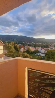 a view of a city from the balcony of a building at Apartman Djordjevic in Soko Banja