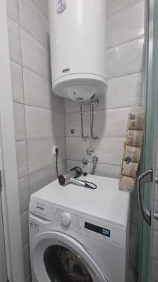 a washer and dryer in a small room at Apartman Djordjevic in Soko Banja