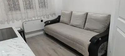 a couch in the corner of a room at Temački amanet in Pirot