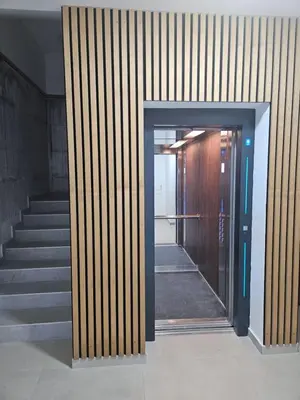 a hallway with stairs and an open door at Studio apartman Gold in Vrnjci