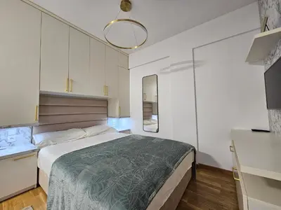 a bedroom with a large bed in a room at Studio apartman Gold in Vrnjci