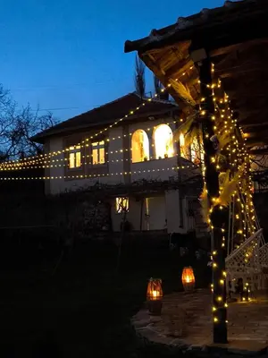 a house decorated with christmas lights at night at Vila Kruna in Pirot