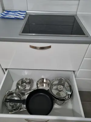a kitchen sink with pots and pans on it at Apartman BN in Vrnjačka Banja
