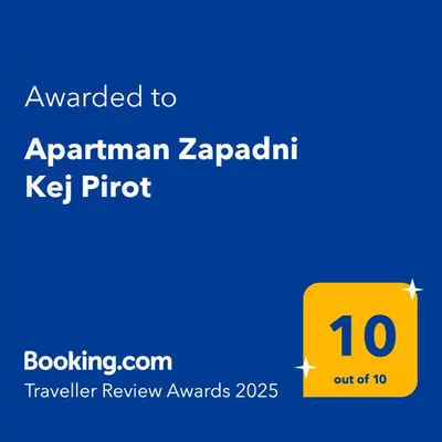 a yellow sign with the text awarded to aprilan zaparin ket at Apartman Zapadni Kej Pirot in Pirot