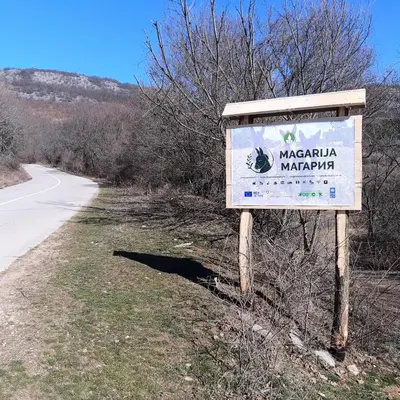 a sign on the side of a road at Magarija 1 in Dimitrovgrad