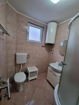 a bathroom with a toilet and a sink at Vila MINJA in Soko Banja