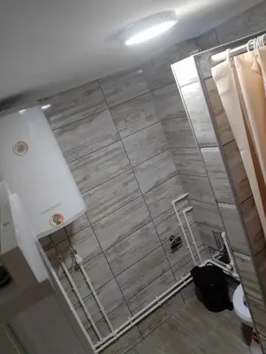 a bathroom with a shower with a toilet at Apartmani Petrović in Soko Banja
