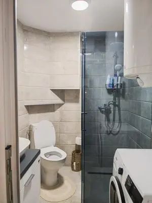 a bathroom with a toilet and a walk in shower at Studio D&I in Vranje