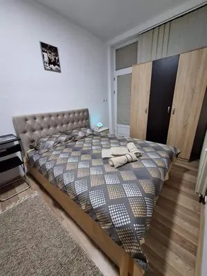 a bedroom with a large bed in a room at Studio D&I in Vranje