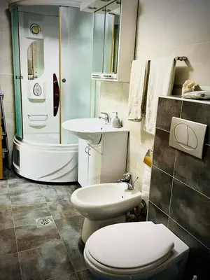 a bathroom with a toilet and a sink at Apartman Family in Vrnjačka Banja
