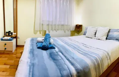 a bedroom with a blue stuffed animal on a bed at Apartman Family in Vrnjačka Banja