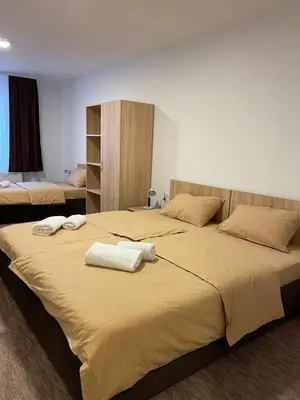 a bedroom with two beds with towels on them at 4 vodenice Brzeće B&B in Brzeće