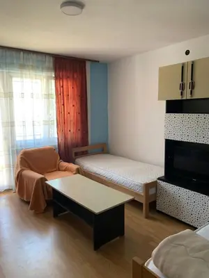 a small room with a bed and a couch at Kuca u Prokuplju in Prokuplje