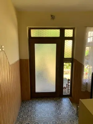 a door in a room with a glass door at Kuca u Prokuplju in Prokuplje