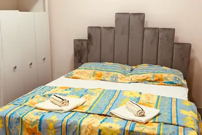 a bedroom with a bed with two towels on it at Jelena in Vranje