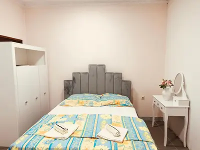 a bedroom with a bed with two towels on it at Jelena in Vranje
