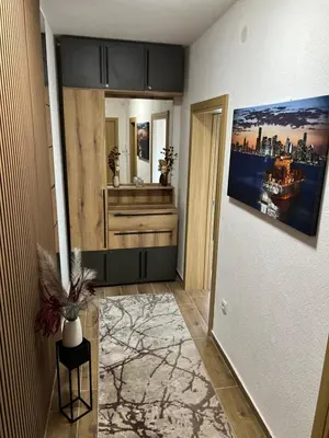 a room with a hallway with a painting on the wall at Apartman Tina , kod hotela Sunce in Soko Banja