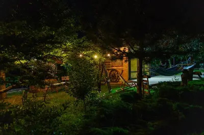 a park with a playground with a slide at night at SPA apartman Tomin adults only in Soko Banja