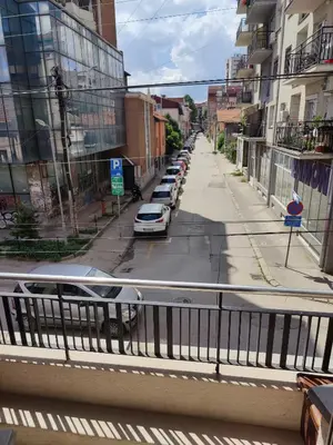 a view of a street with cars parked on the road at 