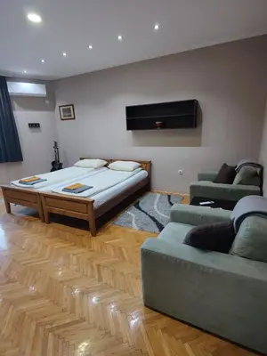 a living room with a bed and a couch at 