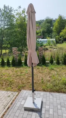 an umbrella on a stand on a patio at Royal Villa - HAWAII in Vrnjačka Banja