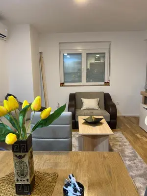a living room with a couch and a table at Rtanj in Soko Banja