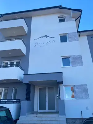 a white building with a sign on it at Rtanj in Soko Banja