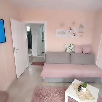 a living room with a couch and a table at Sokobanja na dlanu in Soko Banja