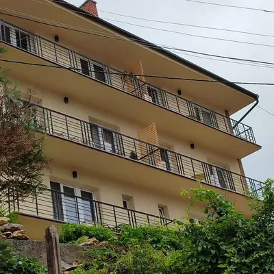 a building with balconies on the side of it at Sokobanja na dlanu in Soko Banja
