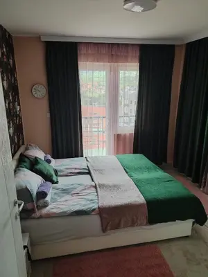 a bedroom with a bed with a window and a bed sidx sidx sidx at Sokobanja na dlanu in Soko Banja