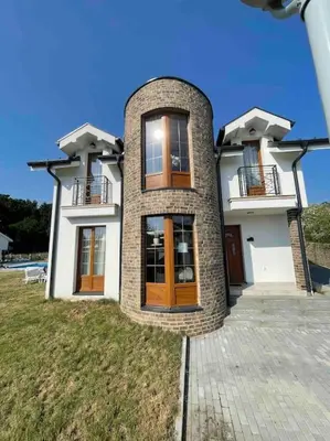 a large brick house with two balconies on top at Royal King Villa 2 in Vrnjačka Banja