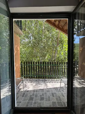 a view of a patio through a sliding glass door at Lola in Prolomska Banja