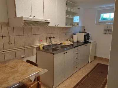 a kitchen with a sink and a counter top at Studio Petrović in Soko Banja