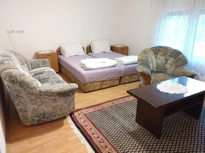 a living room with a couch and two chairs and a table at Studio Petrović in Soko Banja