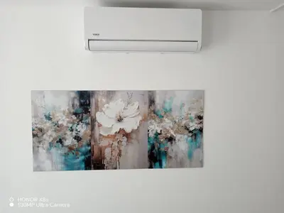 a picture of a flower painting on a wall at Apartman predah Vranje FREE PARKING U SKLOPU JEDINICE in Vranje
