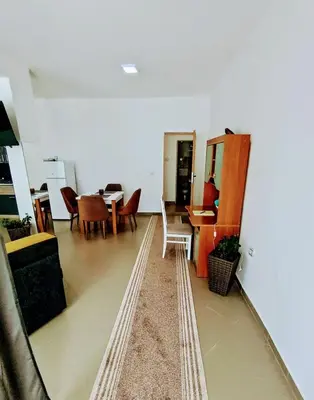 a living room with a table and chairs at Apartman predah Vranje FREE PARKING U SKLOPU JEDINICE in Vranje