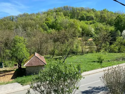 a small building on the side of a road at Miletića čardak Ribarska Banja in Ribarska Banja