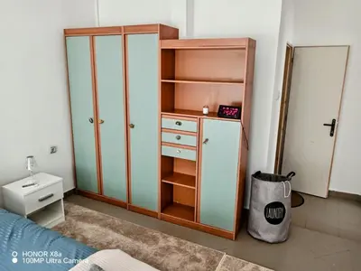 a bedroom with a bed and a cabinet and a sink at Predah in Vranje