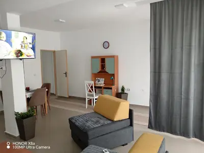 a living room with a couch and a flat screen tv at Predah in Vranje
