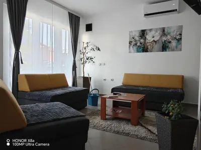 a living room with two couches and a coffee table at Predah in Vranje